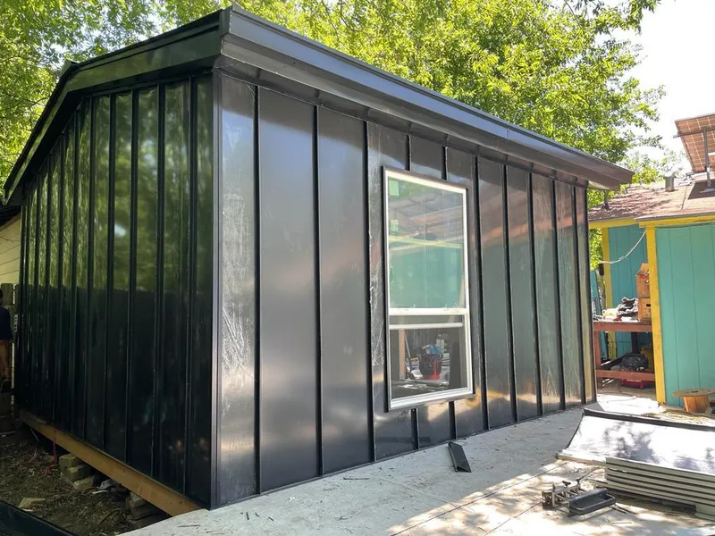 Black standing seam metal wall panels for Roof Inspection in Eagan