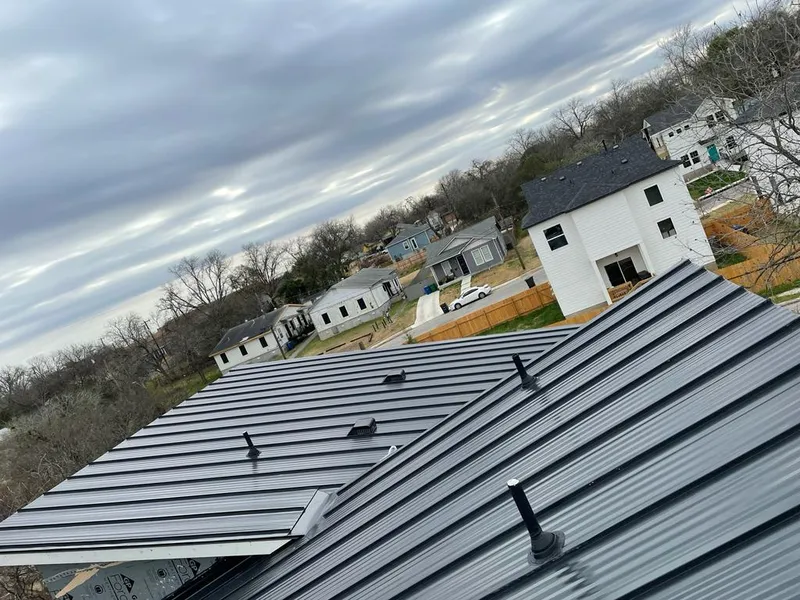 Standing seam metal roof panels with vents for Skylight Repair in Eagan